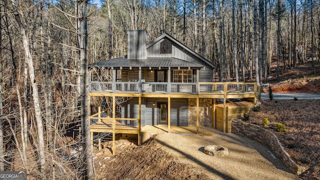 rear view of house featuring a deck