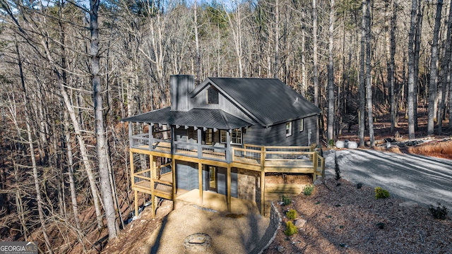 view of front of property with a wooden deck