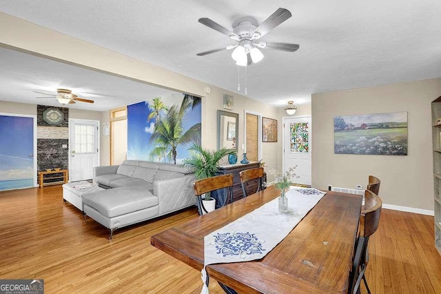 dining space featuring ceiling fan and light hardwood / wood-style floors