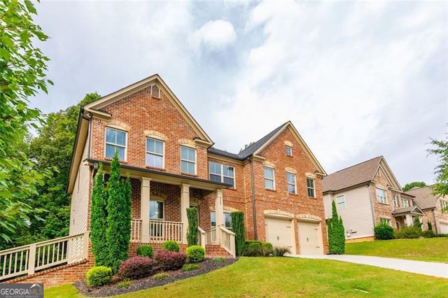 craftsman inspired home with a garage, a front lawn, and a porch