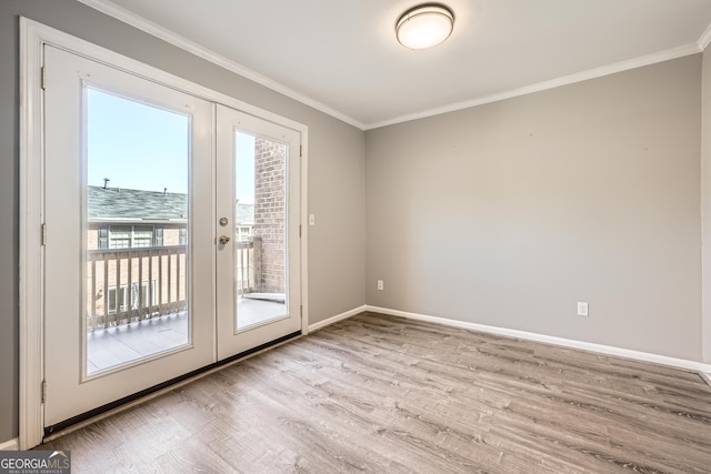 doorway to outside featuring french doors, crown molding, light wood-style flooring, and baseboards