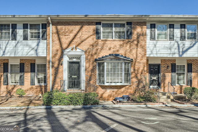 multi unit property featuring brick siding