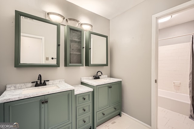 bathroom with baseboards, two vanities, a sink, and shower / tub combo with curtain