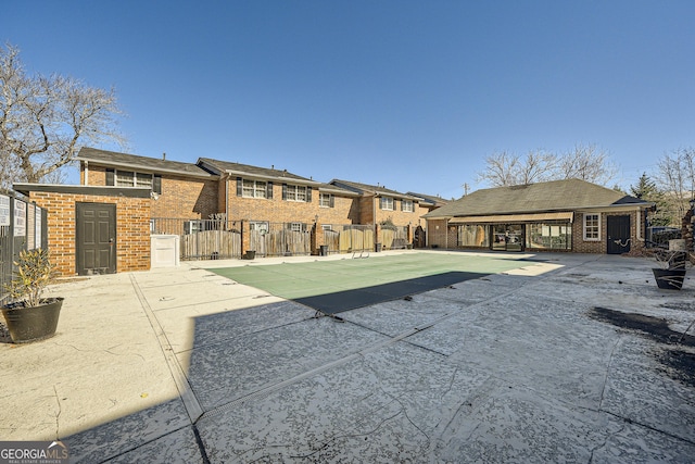 view of swimming pool with fence and a patio