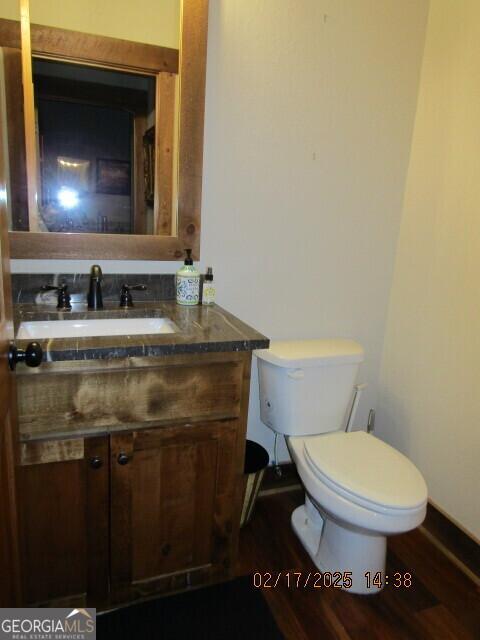 bathroom with toilet and vanity