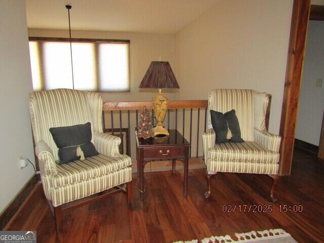 sitting room featuring wood-type flooring