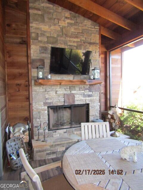 view of patio featuring an outdoor stone fireplace