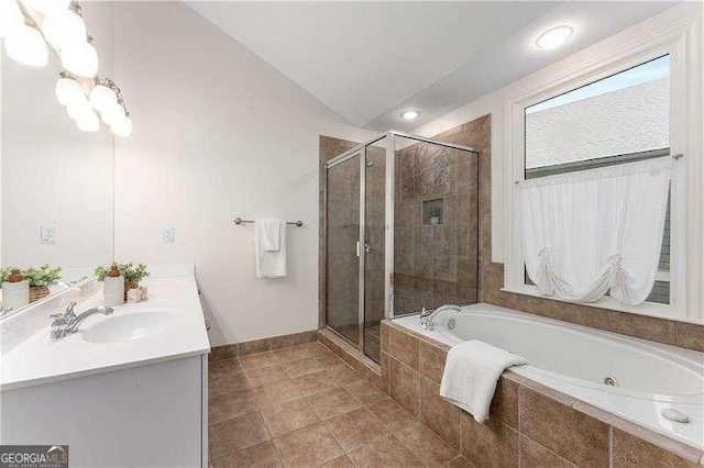 bathroom featuring tile patterned floors, vanity, plus walk in shower, and lofted ceiling