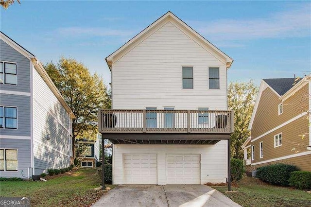 exterior space with a garage and a balcony