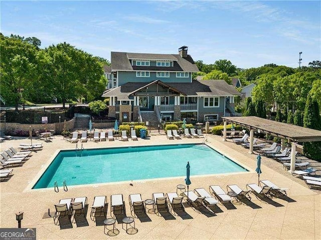 view of swimming pool featuring a patio area