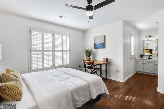 bedroom with dark hardwood / wood-style floors