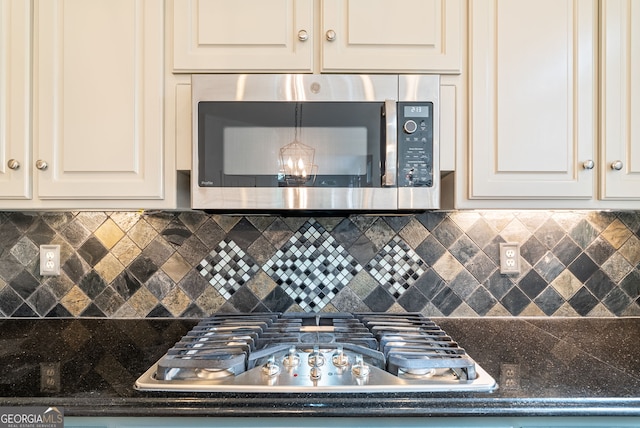 kitchen featuring stainless steel appliances and decorative backsplash