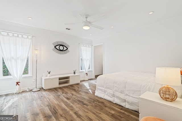 unfurnished bedroom featuring ornamental molding, hardwood / wood-style flooring, and ceiling fan