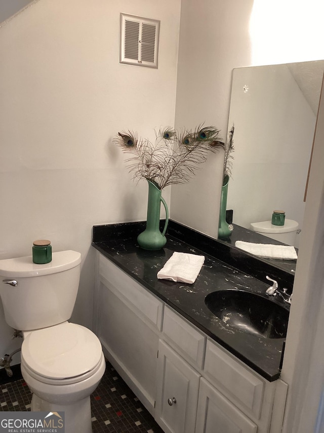 307 Adair St Unit E7, Decatur, GA 30030 - half bath featuring toilet, tile patterned flooring, and vanity