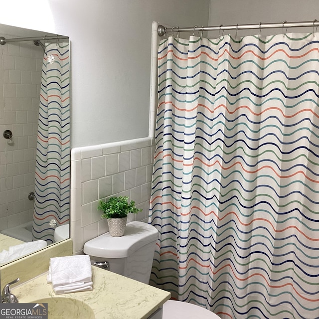 307 Adair St Unit E7, Decatur, GA 30030 - bathroom with toilet, vanity, shower / tub combo, and tile walls