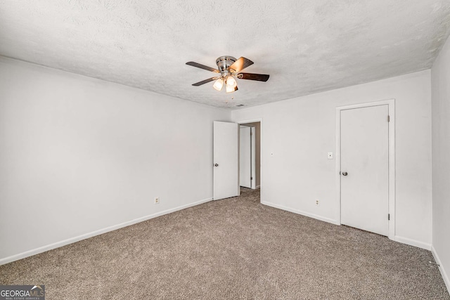 unfurnished bedroom featuring carpet flooring, baseboards, a textured ceiling, and a ceiling fan