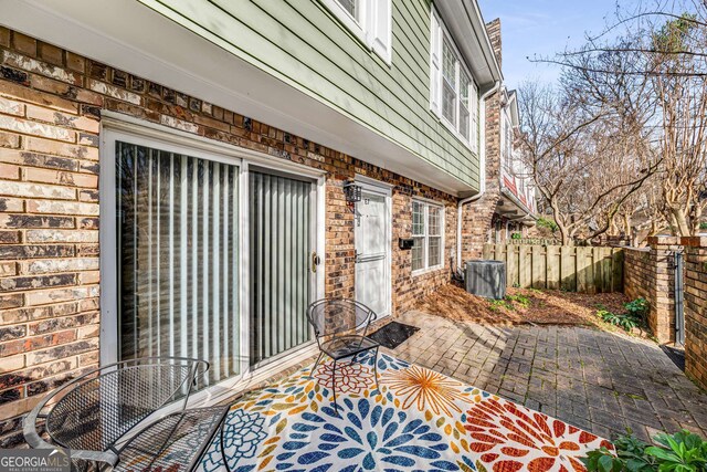 view of patio featuring fence
