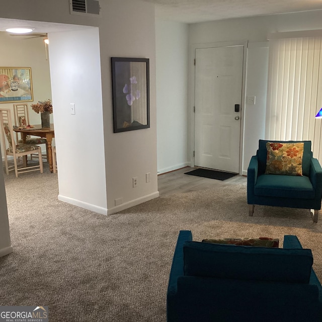 307 Adair St Unit E7, Decatur, GA 30030 - carpeted living room with baseboards
