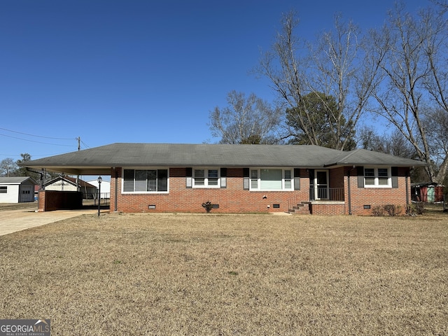 ranch-style home with crawl space, driveway, an attached carport, and brick siding