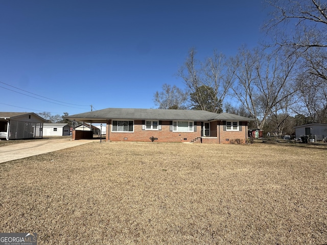 ranch-style home with brick siding, concrete driveway, crawl space, a carport, and a front yard