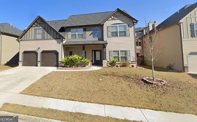 craftsman-style house featuring a front yard and a garage