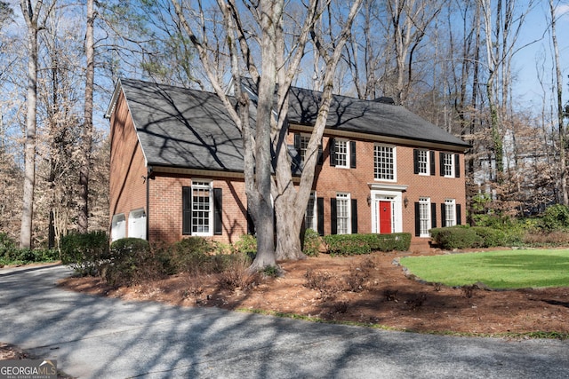 colonial inspired home with a garage