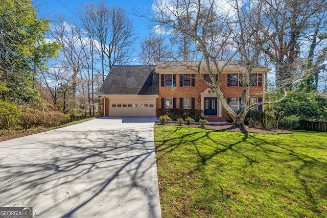 colonial inspired home with a garage, fence, a front lawn, and brick siding