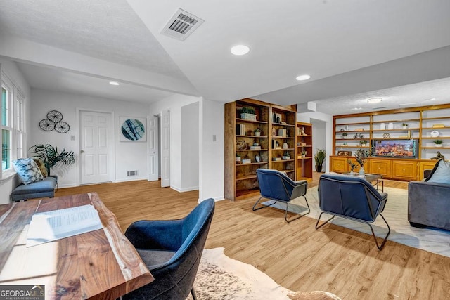 office area featuring recessed lighting, baseboards, visible vents, and light wood finished floors