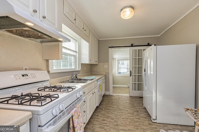 kitchen featuring ornamental molding, sink, white appliances, and white cabinets