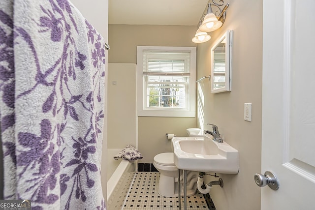 full bathroom with sink, toilet, bathtub / shower combination, and tile patterned flooring