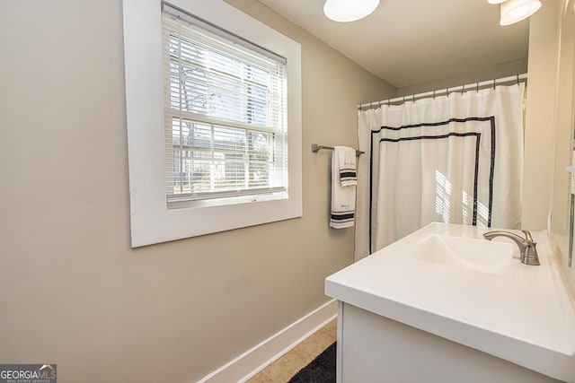 bathroom with vanity and curtained shower