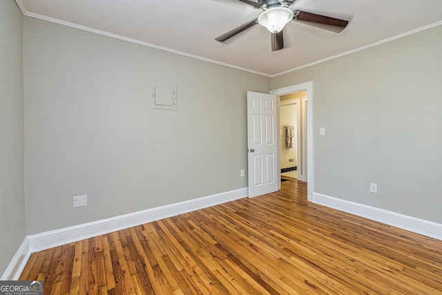 unfurnished room featuring ceiling fan, ornamental molding, and hardwood / wood-style floors