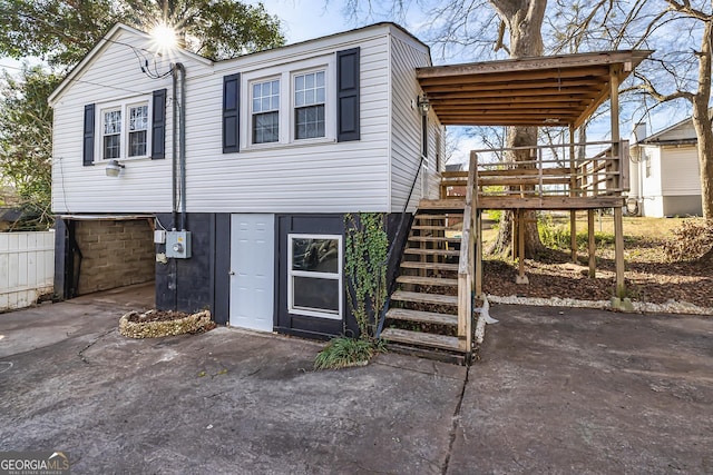 view of front of house featuring a wooden deck