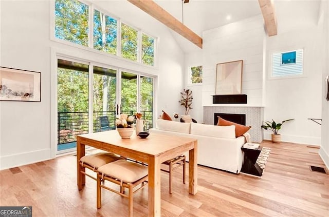 sunroom featuring beamed ceiling