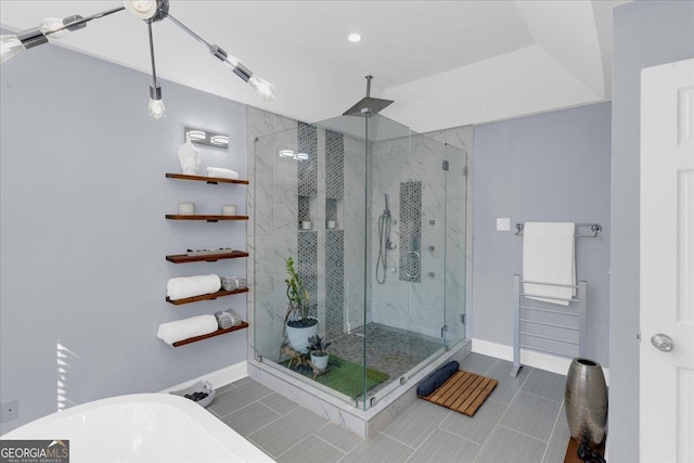 full bathroom featuring baseboards and a marble finish shower