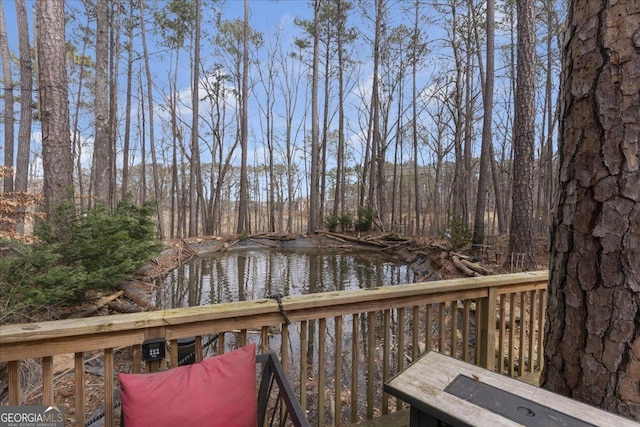 wooden deck featuring a water view