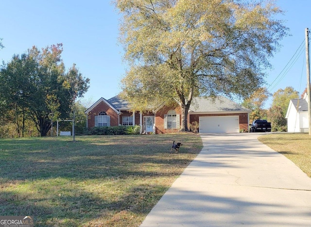 view of front of property featuring a front yard and a garage