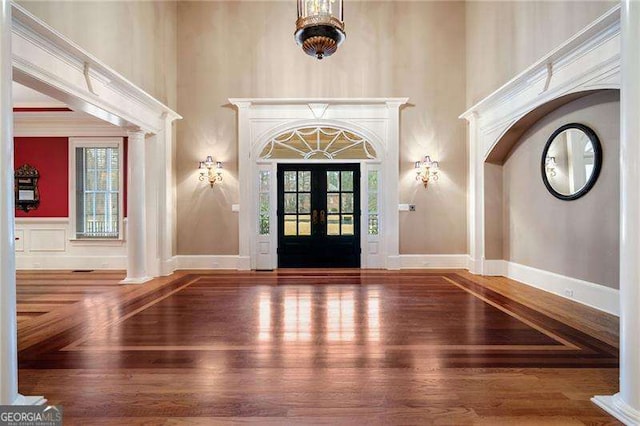 3201 Hobsons Ridge Trl NW, Acworth, GA 30101 - entryway with a towering ceiling, wood finished floors, ornate columns, and arched walkways