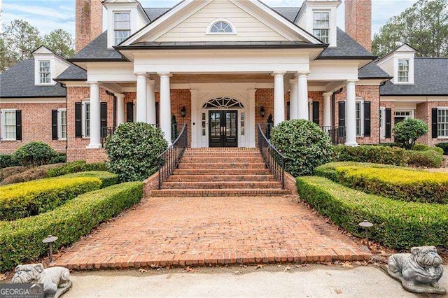 3201 Hobsons Ridge Trl NW, Acworth, GA 30101 - view of front of property with a chimney, french doors, brick siding, and covered porch