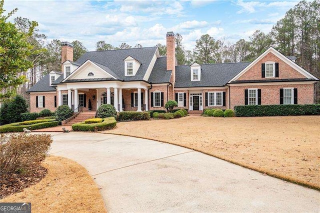 3201 Hobsons Ridge Trl NW, Acworth, GA 30101 - view of front of home featuring brick siding, a porch, and a chimney