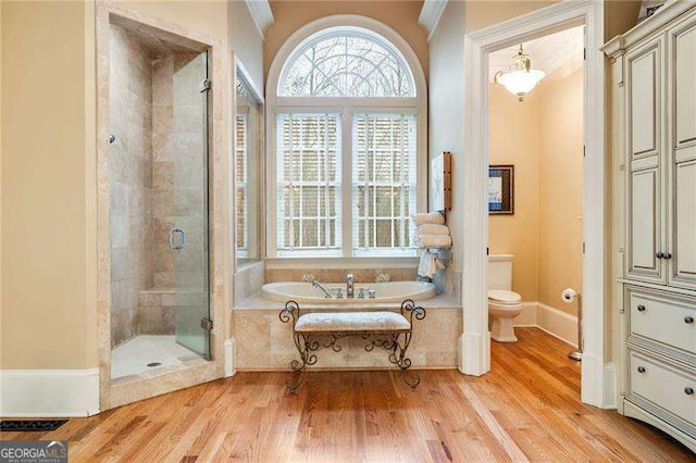 3201 Hobsons Ridge Trl NW, Acworth, GA 30101 - full bath with a garden tub, a stall shower, wood finished floors, and ornamental molding