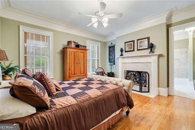 3201 Hobsons Ridge Trl NW, Acworth, GA 30101 - bedroom featuring crown molding, light wood-type flooring, a high end fireplace, and ceiling fan
