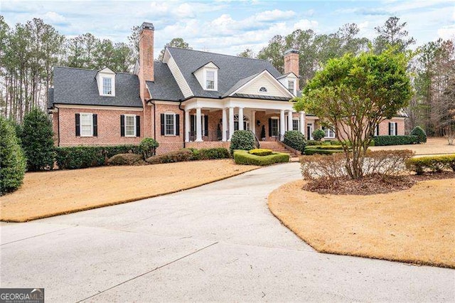 3201 Hobsons Ridge Trl NW, Acworth, GA 30101 - view of front of house featuring brick siding, a chimney, curved driveway, and a porch