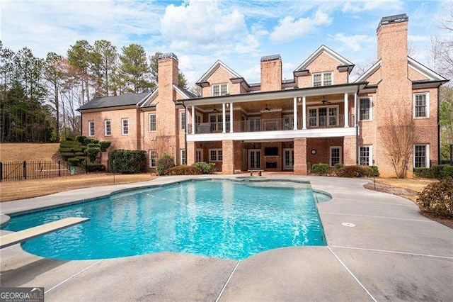 3201 Hobsons Ridge Trl NW, Acworth, GA 30101 - view of swimming pool with ceiling fan, a patio area, and a diving board