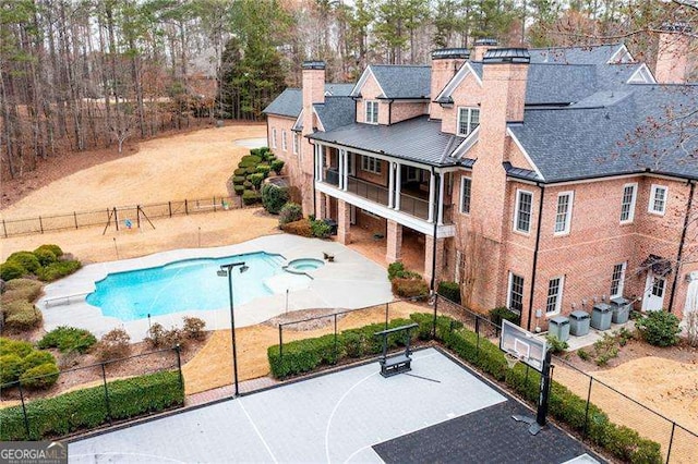 3201 Hobsons Ridge Trl NW, Acworth, GA 30101 - view of swimming pool featuring a pool with connected hot tub and a patio