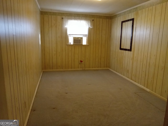 carpeted empty room with cooling unit and wood walls