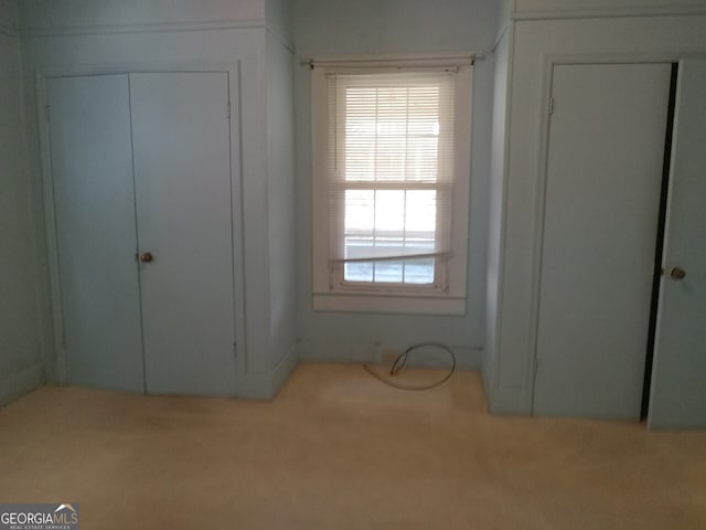 unfurnished bedroom featuring carpet