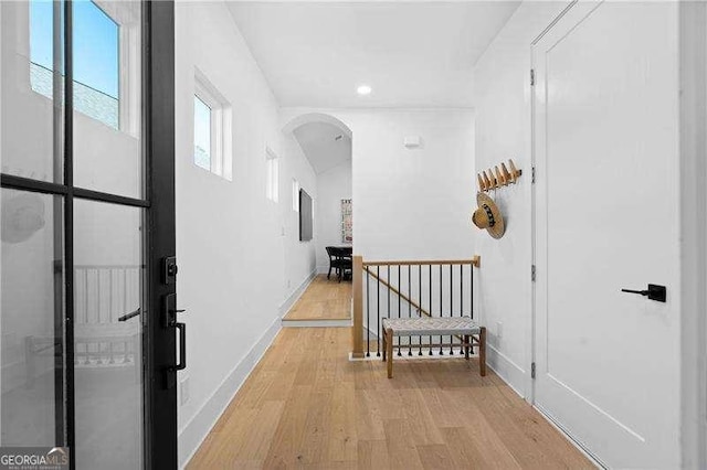 hall with light hardwood / wood-style flooring