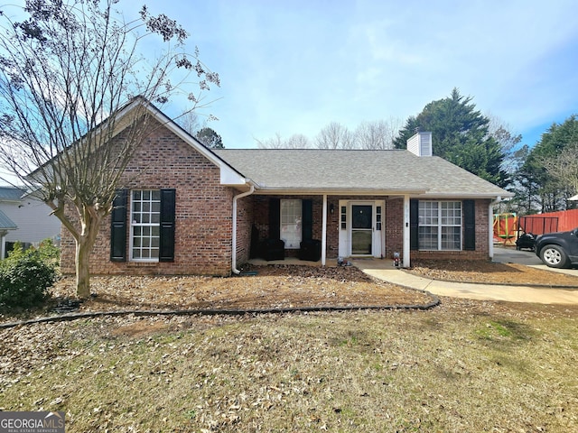 ranch-style home with a front lawn