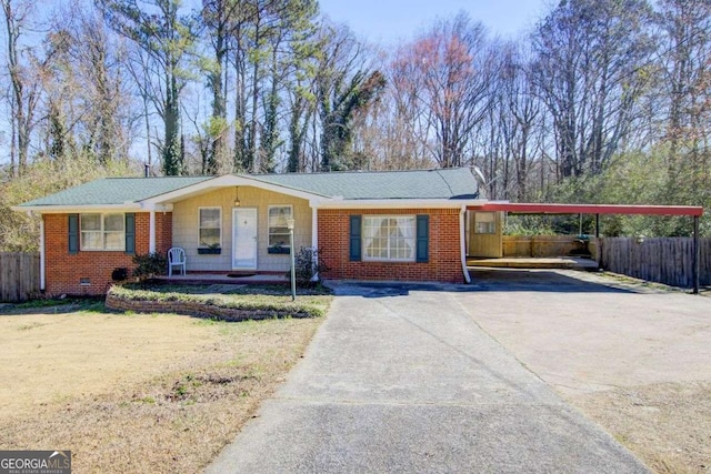 ranch-style house with a carport, a porch, and a front yard